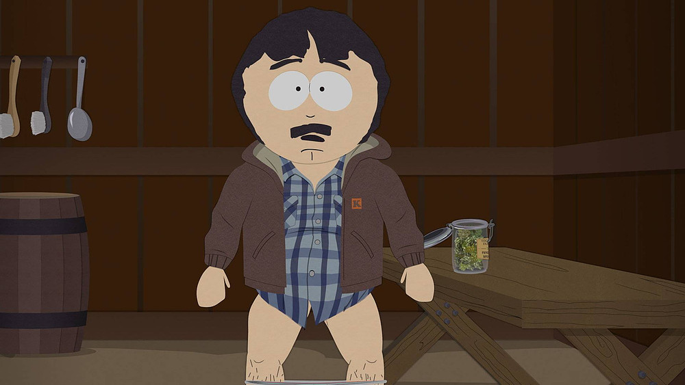 Randy sem as calças, ao lado de um frasco de maconha em South Park