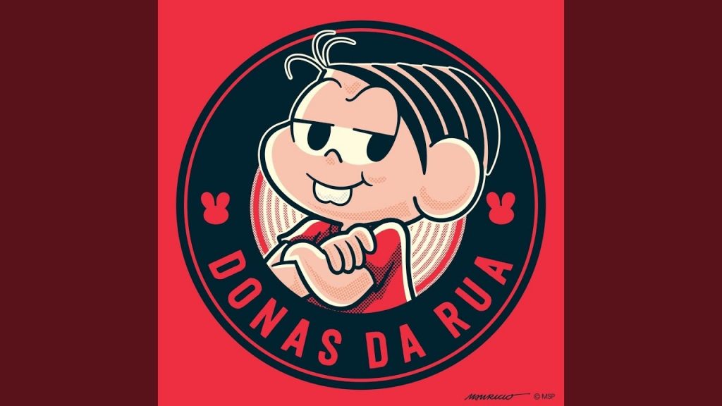 Imagem do projeto Donas da Rua. Nela, a personagem Mônica, da Maurício de Sousa Produções, aparece ao centro, enquadrada por um selo circular preto, escrito "DONAS DA RUA" em letras maiúsculas e em vermelho.