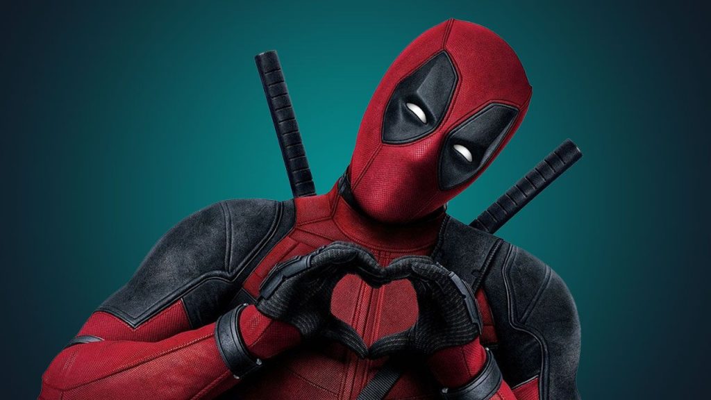 Deadpool de Ryan Reynolds Fazendo coraçãozinho com as mãos - Otageek