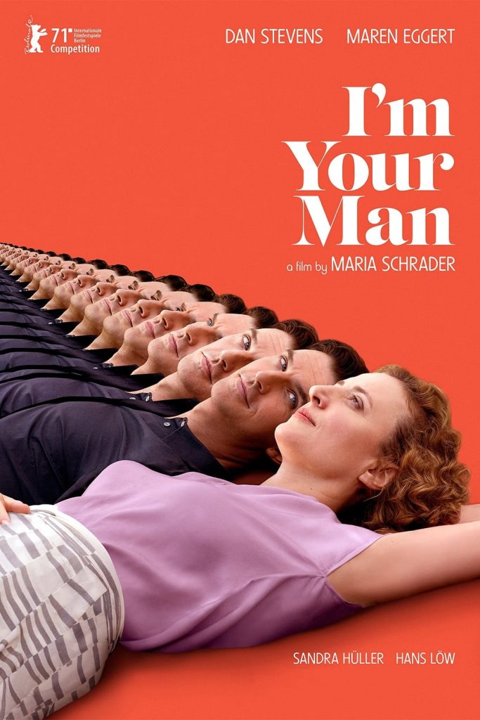 Poster de O homem ideal, com os dois personagens principais deitados em um fundo laranja