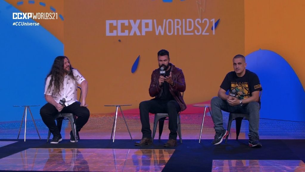 Trilha do Espadachim de Carvão , Marcelo Moreira, Affonso Solano e Anderson Gaveta no palco da CCXP Worlds21. - Otageek