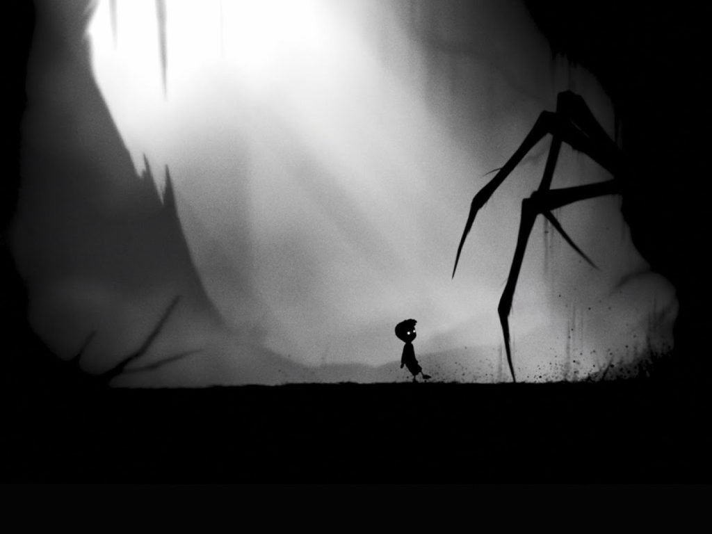O personagem protagonista do game side scrolling Limbo se depara com as pernas de uma aranha gigante - Otageek.
