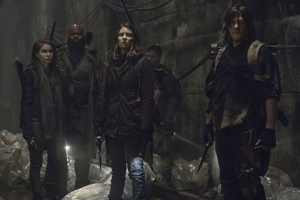 Norman Reedus como Daryl, Lauren Cohan como Maggie e outros personagens em cena de The Walking Dead. - Otageek